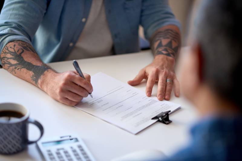 Man signing a contract