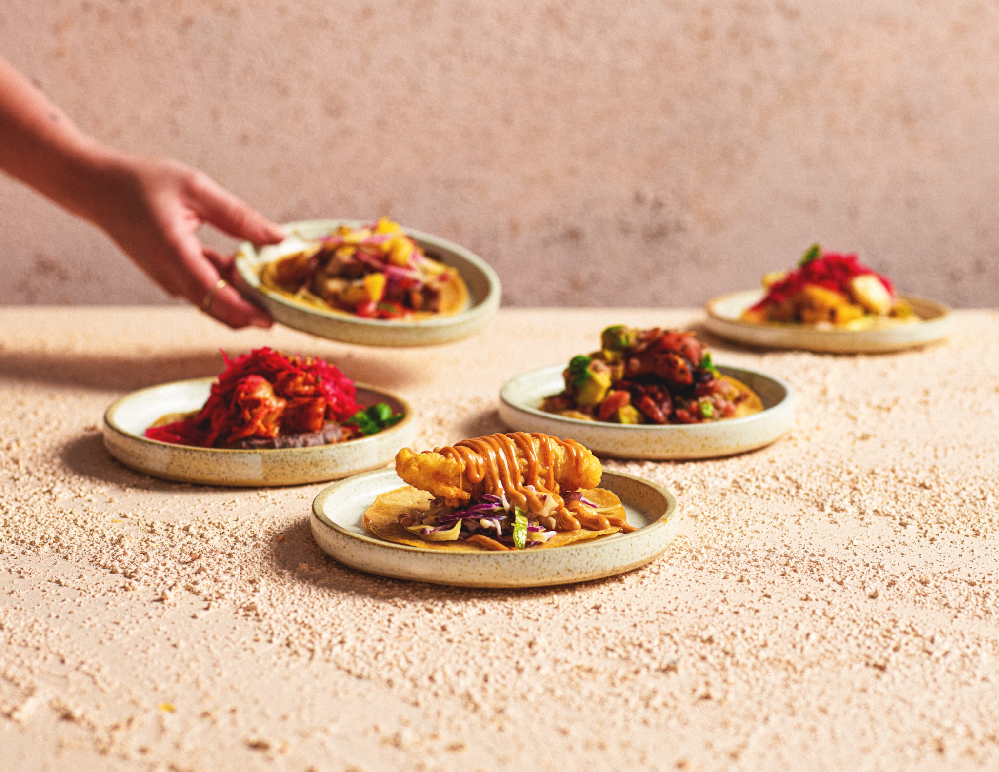 Hand serving mexican food, Alma